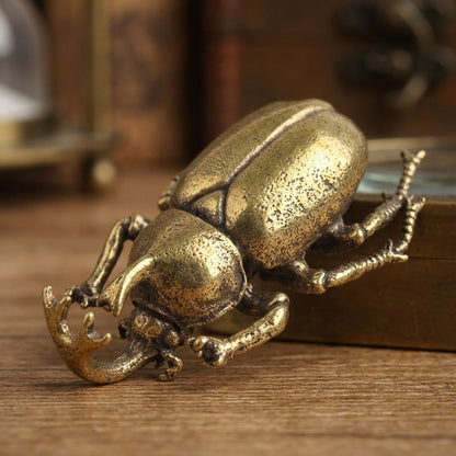 Close-up of the brass scarab beetle ornament, Kiyo Home