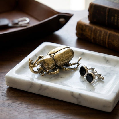 Brass beetle ornament on a marble tray with cufflinks, Kiyo Home