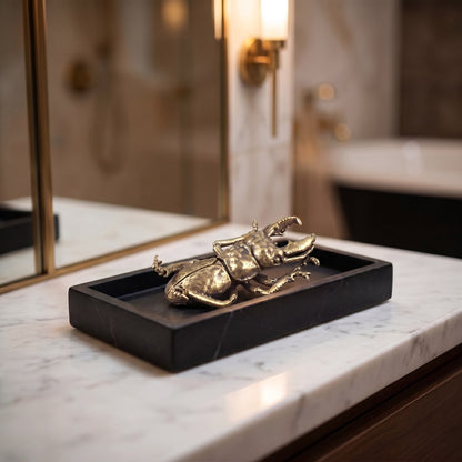 Brass beetle ornament on a black vanity tray, Kiyo Home