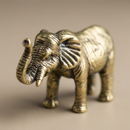 Bronze elephant figurine on a beige background