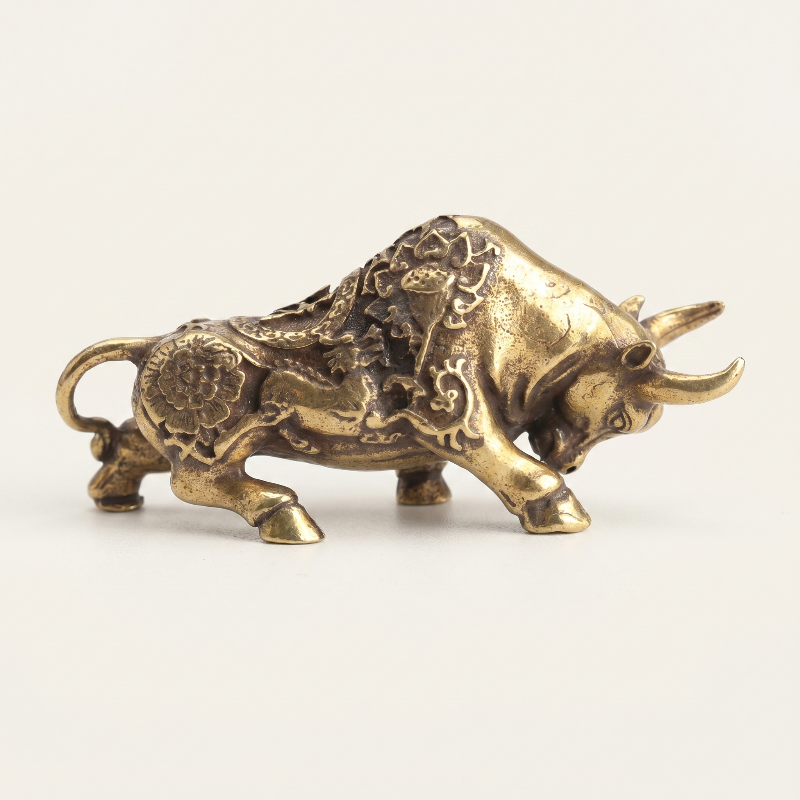 Brass lucky bullfighting figurine on white background