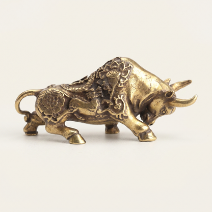 Brass lucky bullfighting figurine on white background
