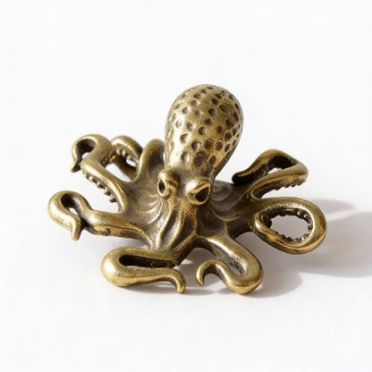 Bronze octopus decorative item on a white background