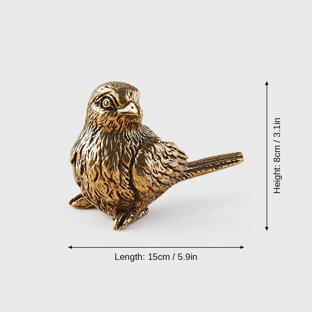 Brass sparrow figurine on a light grey background with size arrows labeled length 15 cm (5.9 in) and height 8 cm (3.1 in)