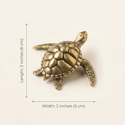 Bronze turtle figurine with measurements on a white background