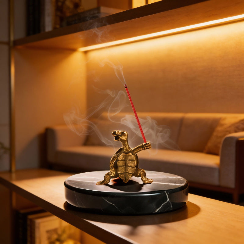 Tortoise-shaped incense burner with smoke on a table in a cozy room.