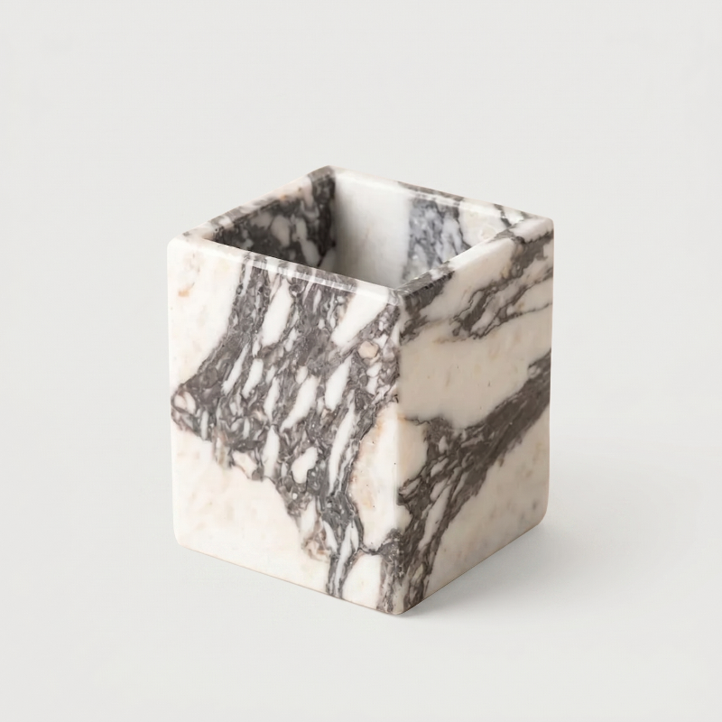Calacatta marble candle holder with a white background.