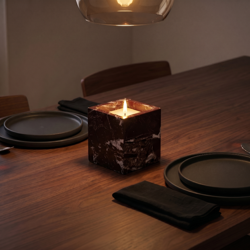 Calacatta black marble candle holder on a dining table.