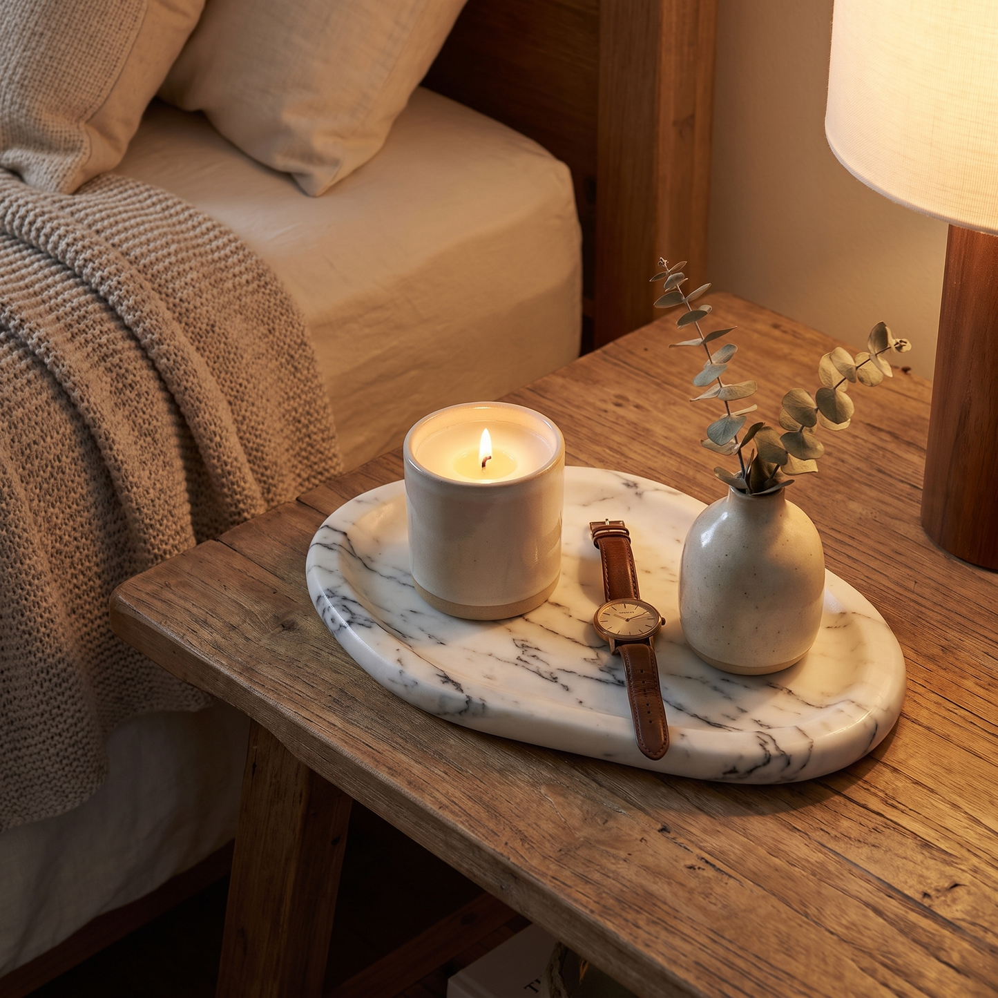 Calacatta marble tray on a bedside table with a candle and eucalyptus, Kiyo Home