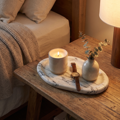 Calacatta marble tray on a bedside table with a candle and eucalyptus, Kiyo Home