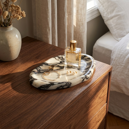 Calacatta marble tray on a walnut dresser holding perfume and jewelry, Kiyo Home