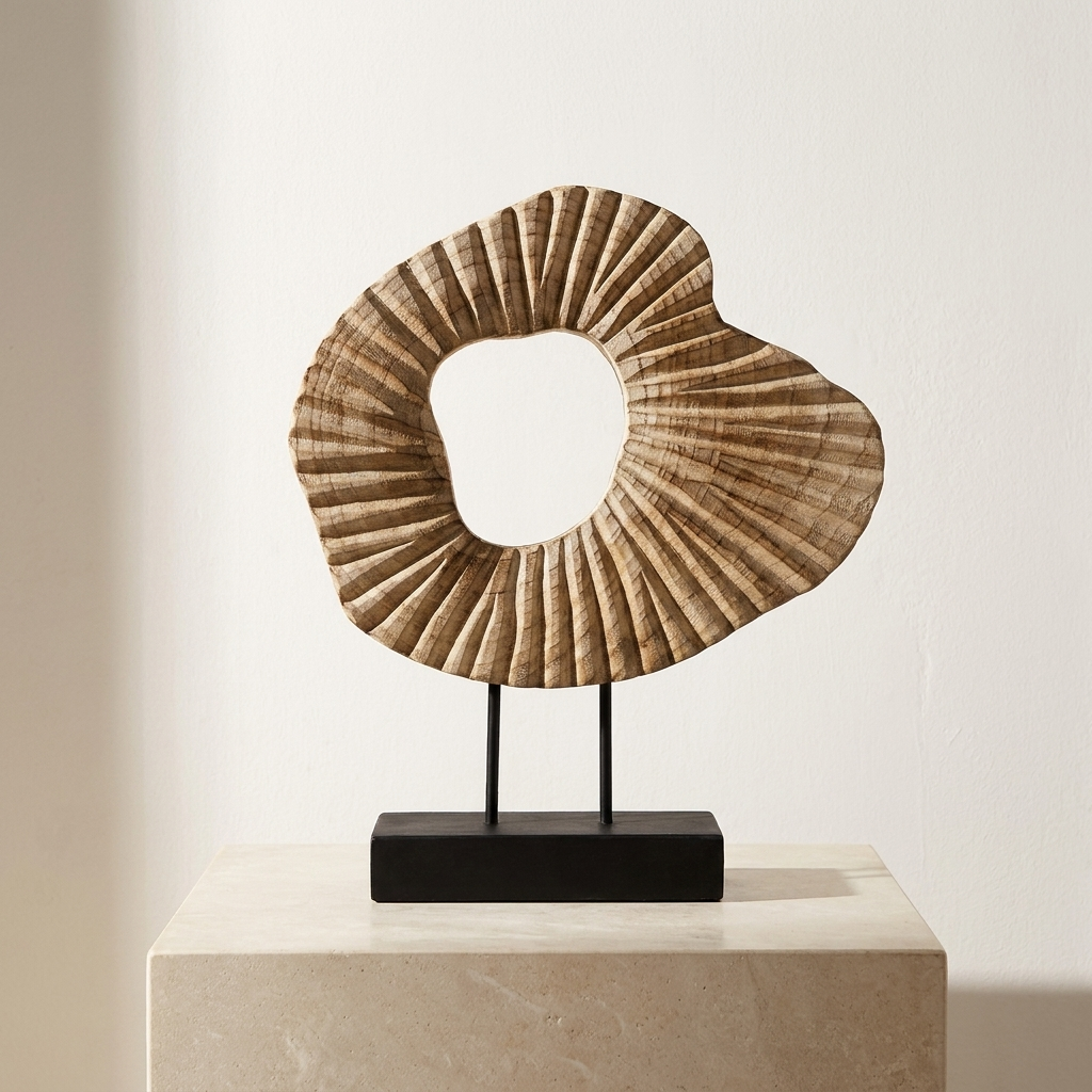 Carved wood abstract sculpture on a metal stand on a bright white plinth, Kiyo Home