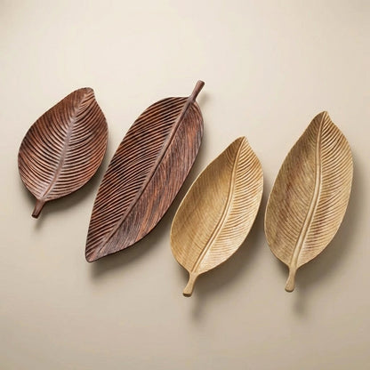 Carved Wood Leaf Serving Trays in dark and light wood finishes shown together for size and color comparison