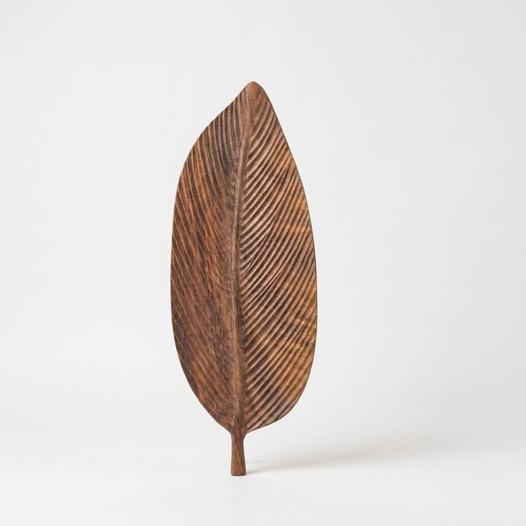 Dark wood Carved Leaf Serving Tray standing upright, alternate hero shot on a clean off-white background