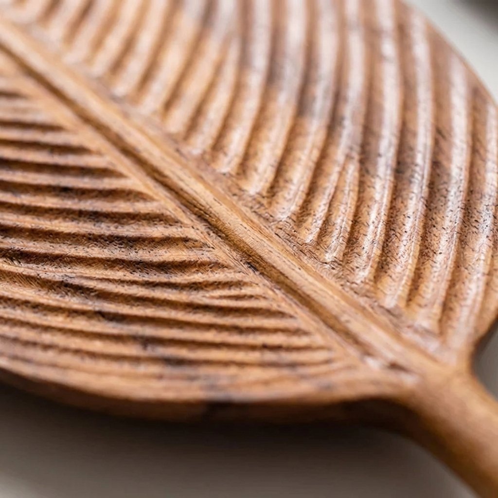 Close-up top view of the Carved Wood Leaf Serving Tray showing the carved leaf vein texture