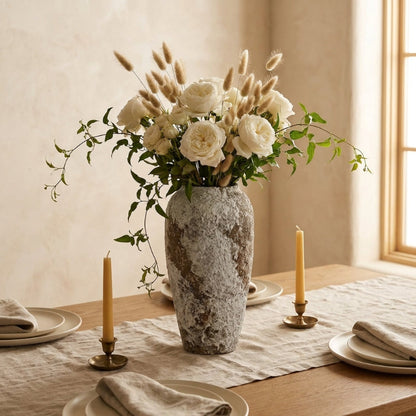 Ceramic rustic circular vases with flowers on dining table