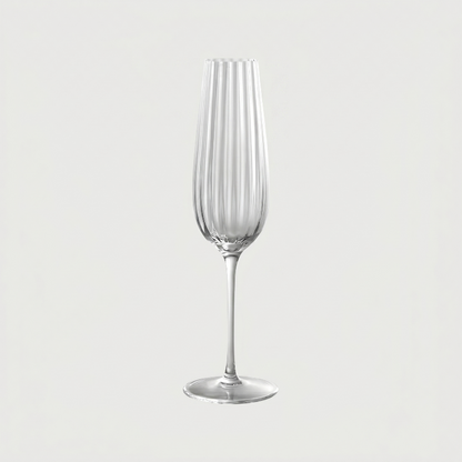 Clear glass flute on a light gray background