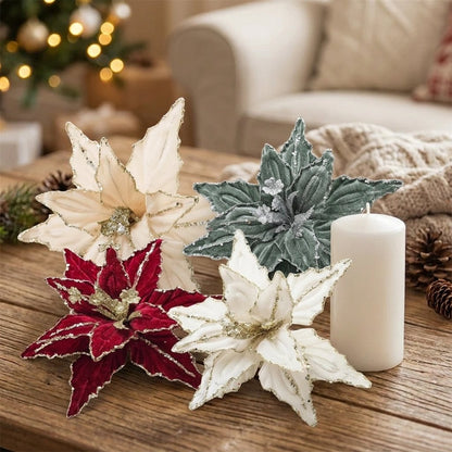 Red, white, champagne and green poinsettia picks on a coffee table with a throw