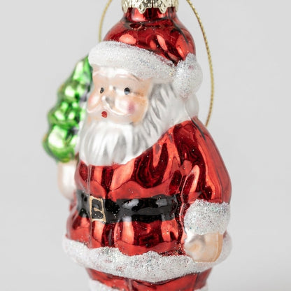 Close-up of Santa ornament showing painted face and glitter trim detail