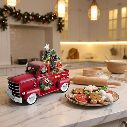 Christmas truck ornament on kitchen counter next to decorated cookies
