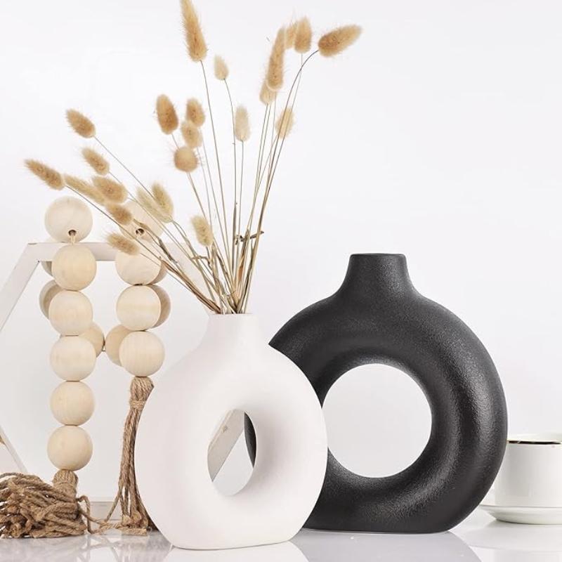 Chic circular vase with a clean, smooth design, perfect for modern home decor.