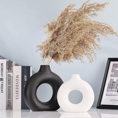 Stylish circular vase, ideal for both contemporary and classic interior designs.