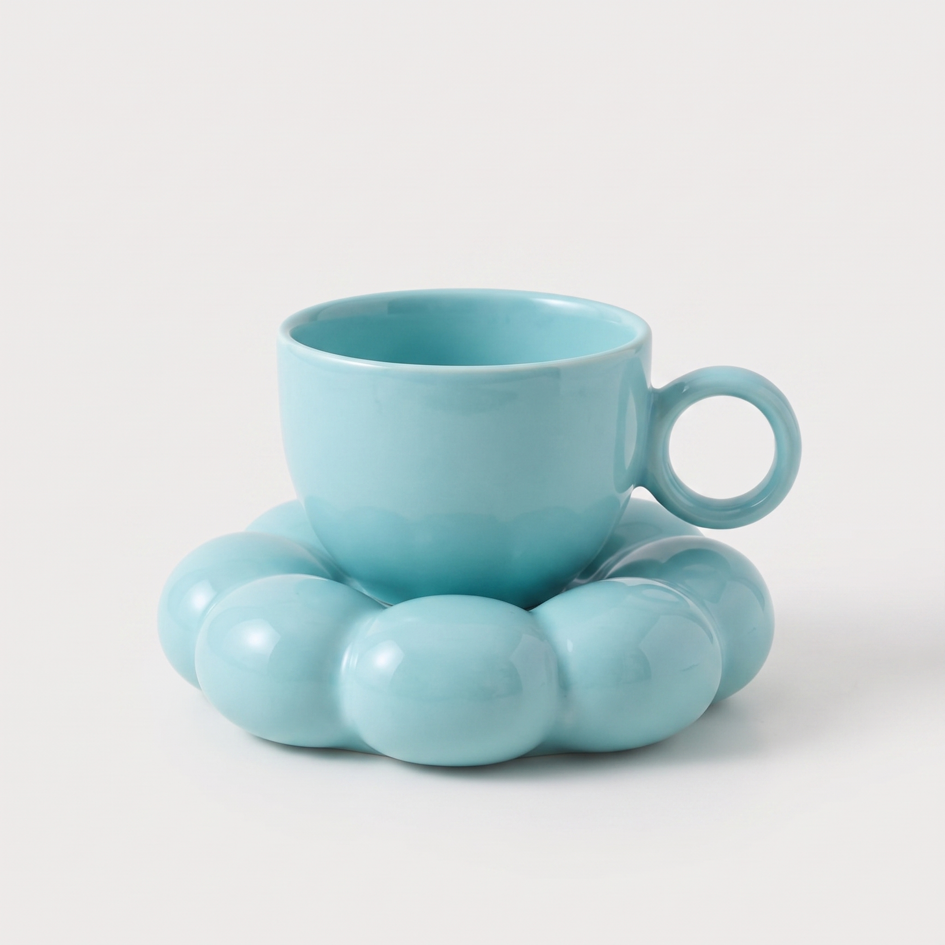 Blue ceramic coffee mug on a cloud-shaped saucer, Kiyo Home cloud saucer mug set