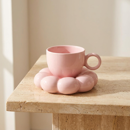 Pink cloud saucer coffee mug on a wooden table, Kiyo Home