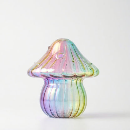 Empty Rainbow iridescent glass mushroom vase on a plain white studio background