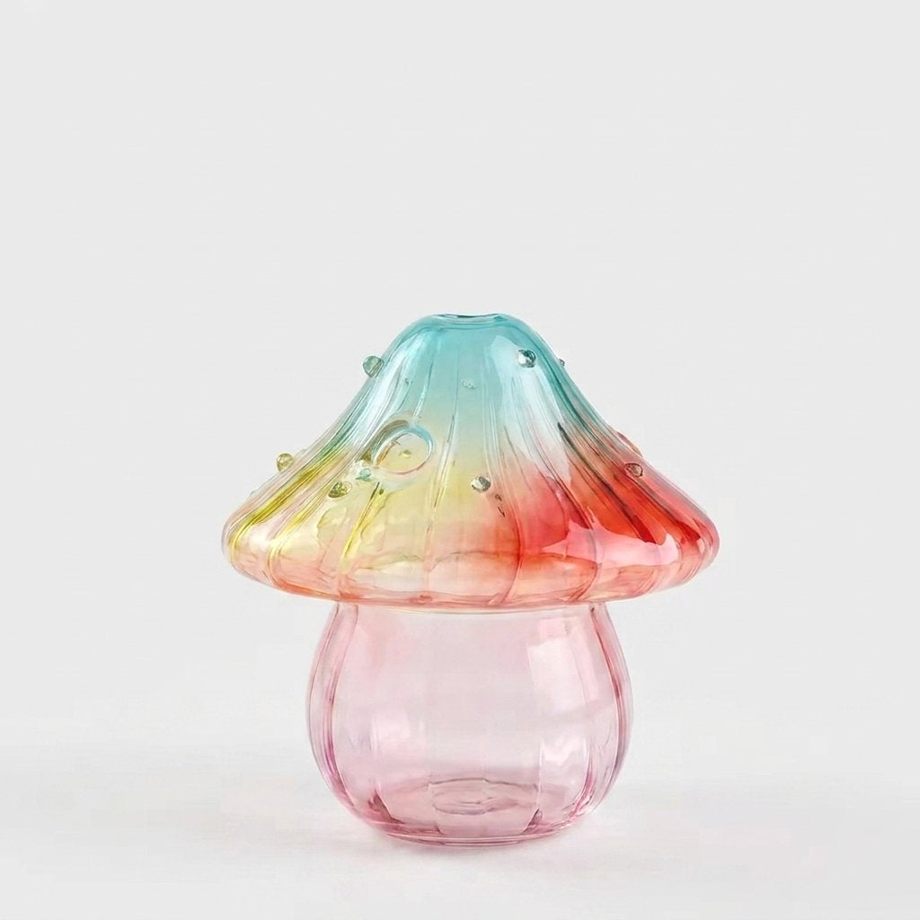 Empty Sunset glass mushroom vase on a plain white studio background