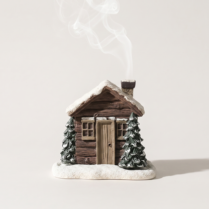 Log cabin cone incense burner with smoke drifting from the chimney, Kiyo Home
