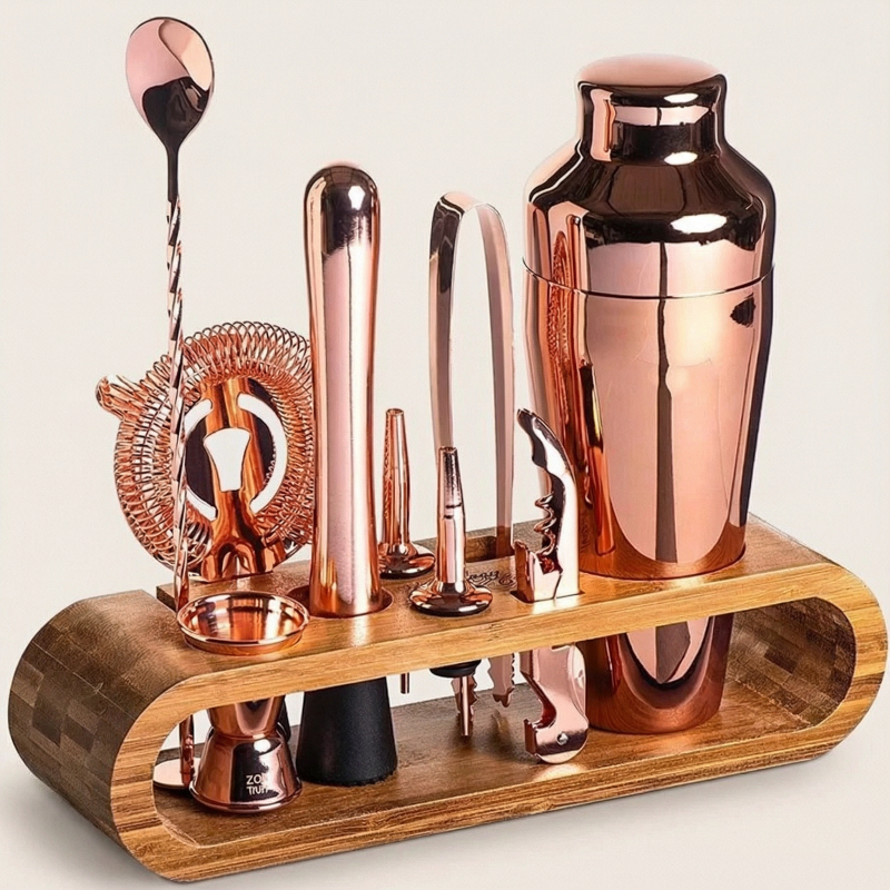 Rose gold 10-piece cocktail bar set with stainless steel tools displayed on a countertop.