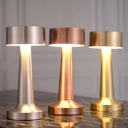 Silver, rose gold and gold cordless table lamps decorated in a living room.