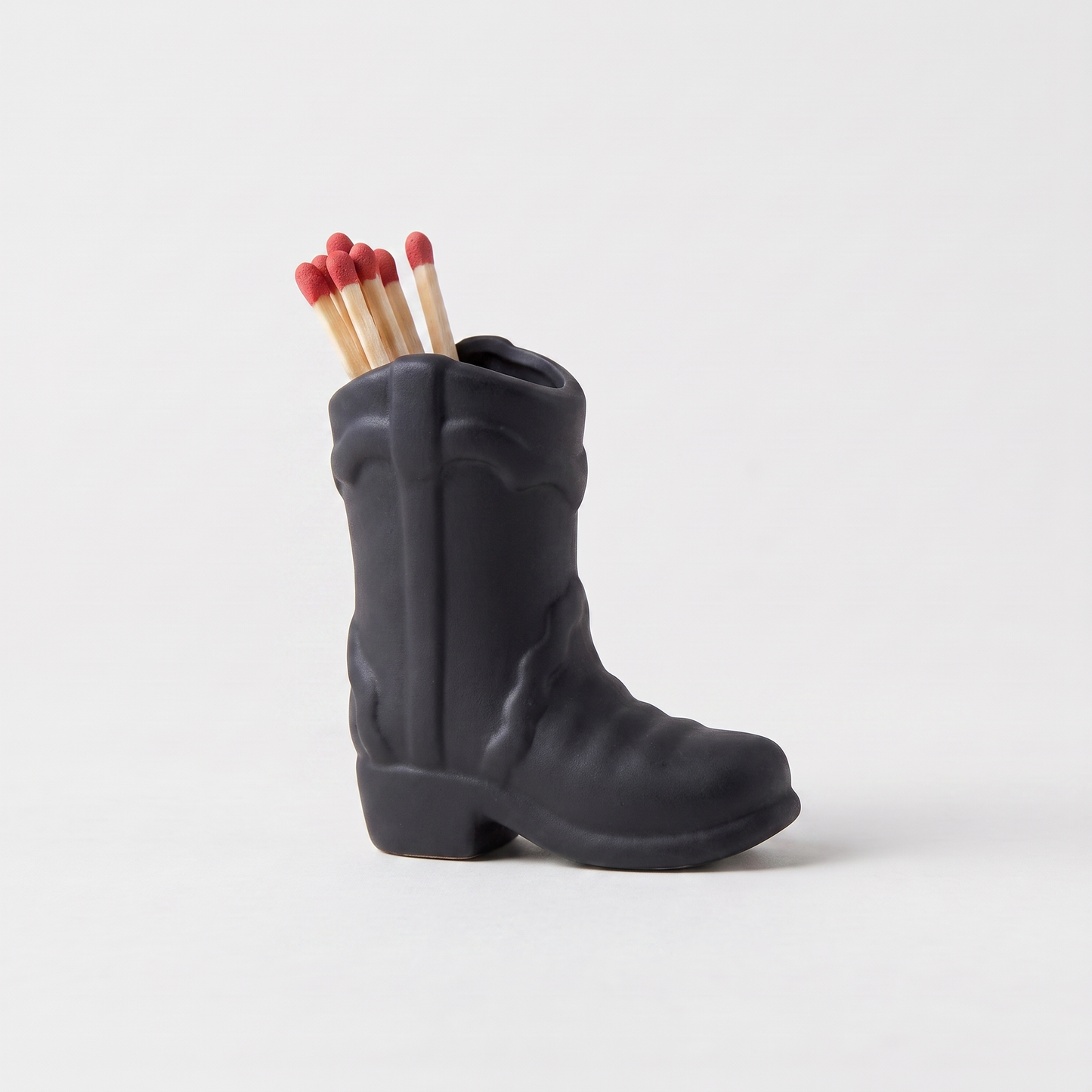 Black ceramic cowboy boot match holder with matchsticks, matte finish, Kiyo Home