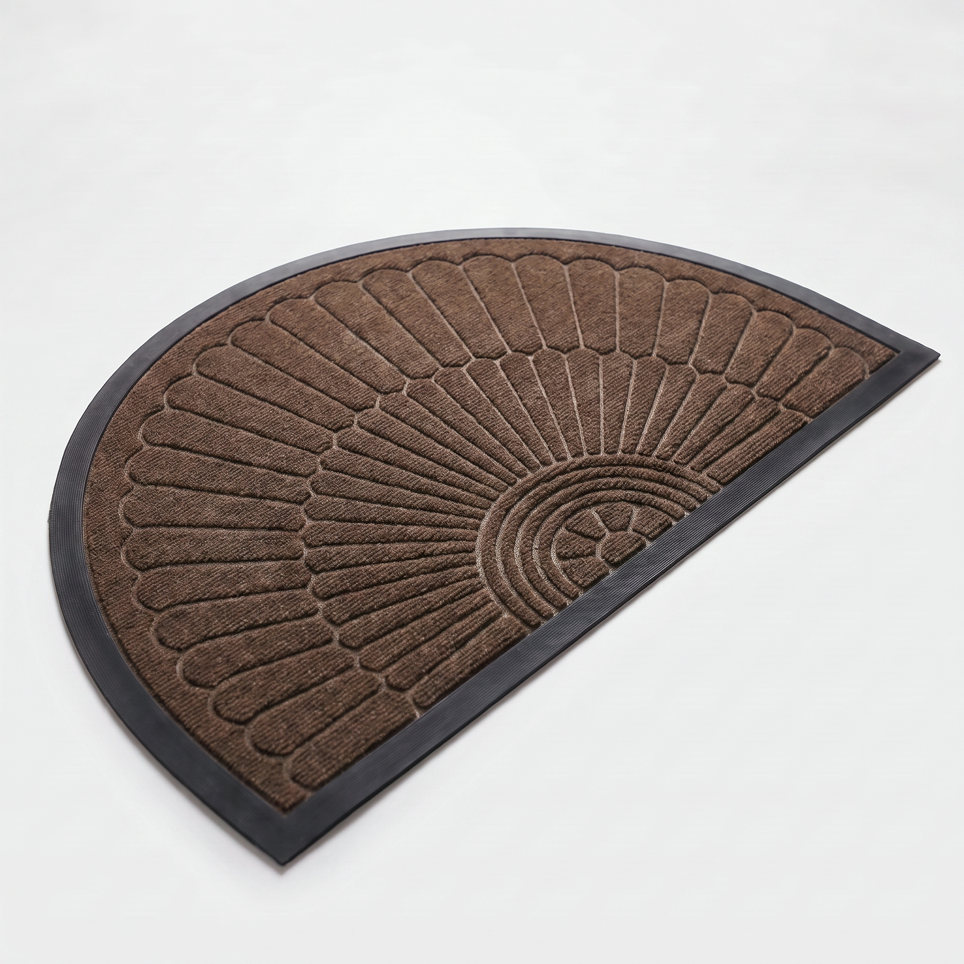 Chocolate brown crescent half-moon door mat with embossed sunburst design and black rubber border on a clean off-white background