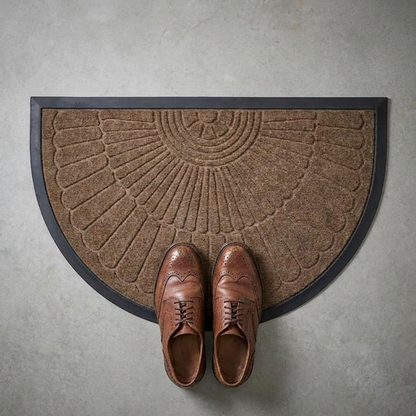 Crescent half-moon door mat shown with a pair of shoes for scale