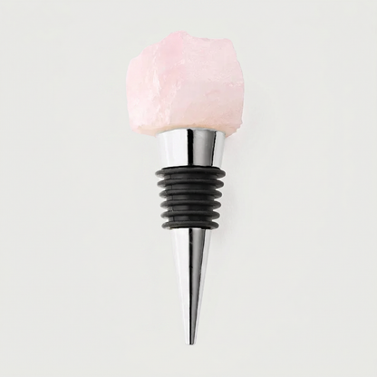 Rose quartz crystal wine bottle stopper on white background