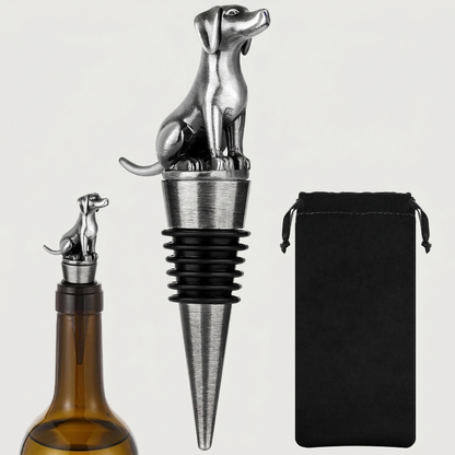 Labrador dog-shaped bottle stopper with a black pouch on a light gray background