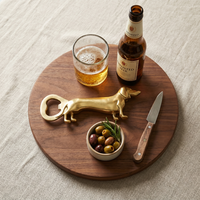 Dachshund bottle opener on round tray with drinks and citrus