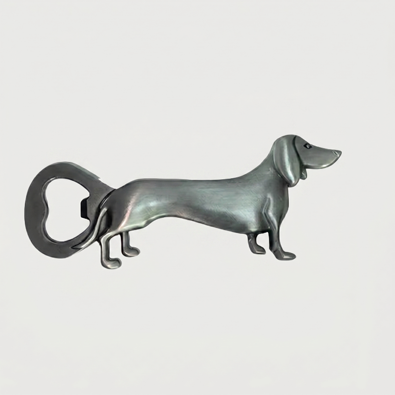 Silver dachshund bottle opener on white background