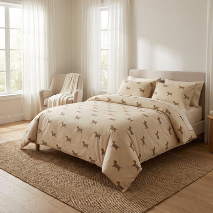 Dachshund-print duvet on a bed in a full bedroom view with an armchair and curtains
