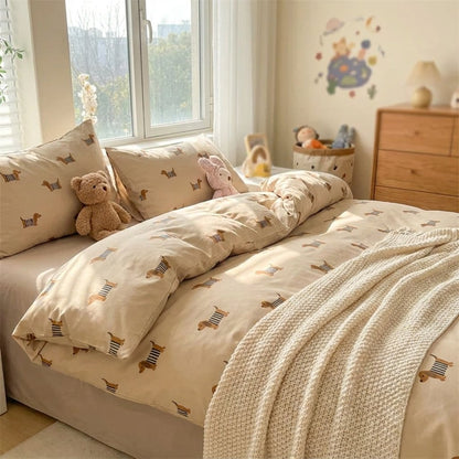 Dachshund-print duvet and pillows in a kids' bedroom with stuffed animals