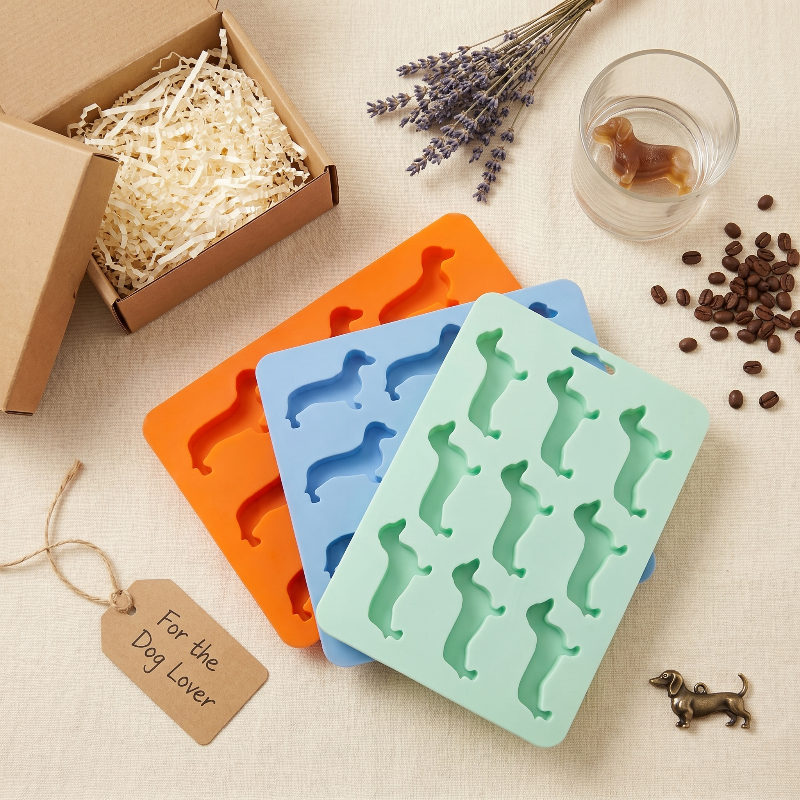 Dachshund ice cube trays with drinks and snack board on wooden table