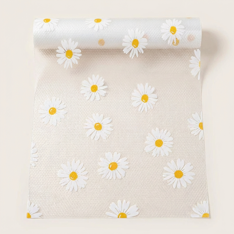 Roll of paper with white daisy flowers on a beige background