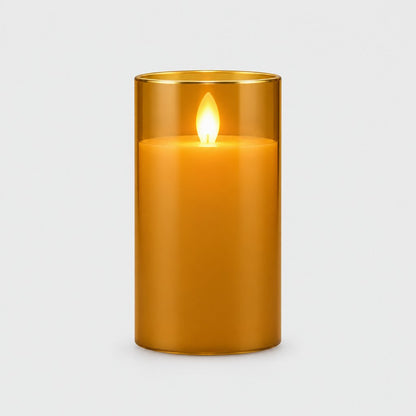 Large amber tinted flameless candle with a glowing flame on a plain light background