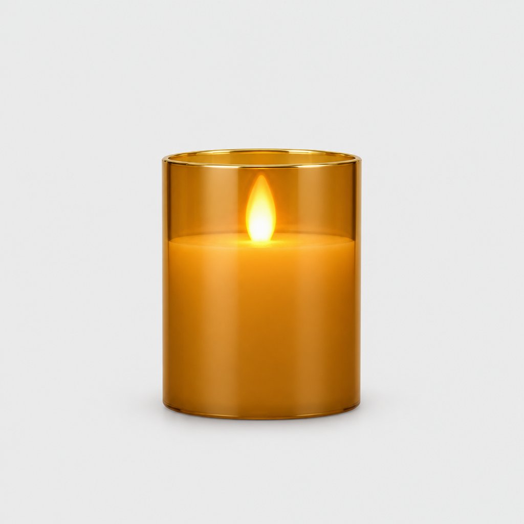 Small amber tinted flameless candle with a glowing flame on a plain light background
