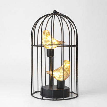 Two Birds illuminated birdcage with two glowing amber glass birds on a white background