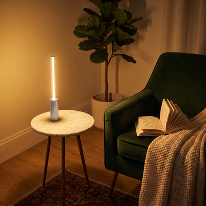 Dimmable rechargeable night light on side table beside green chair