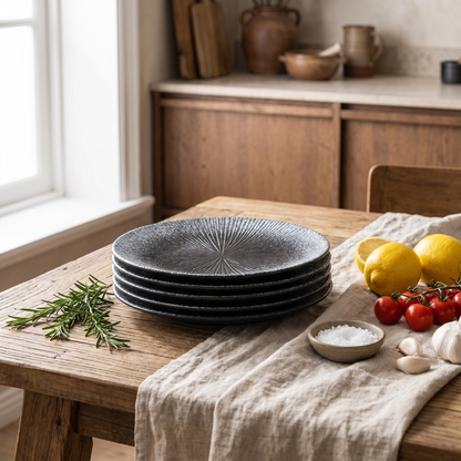 Stack of gray disc ceramic plates styled on a dining table
