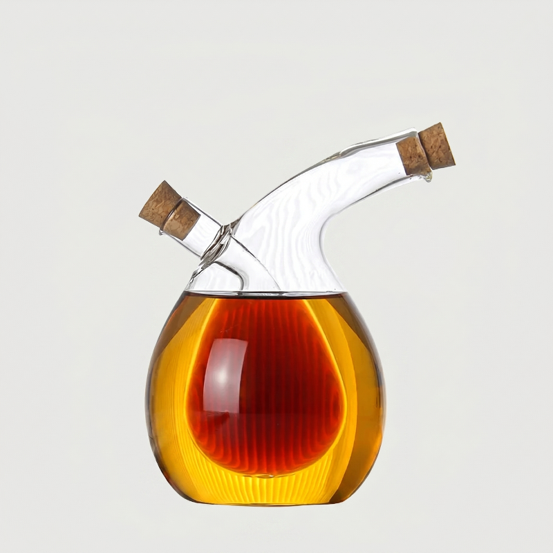 Round dual oil and vinegar bottle on white background with angled spout